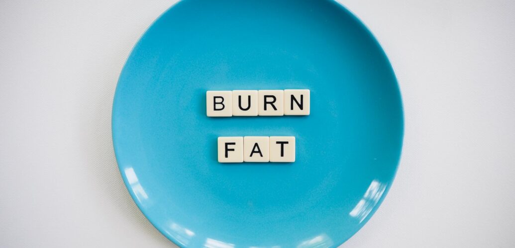 photo of a burn fat text on round blue plate