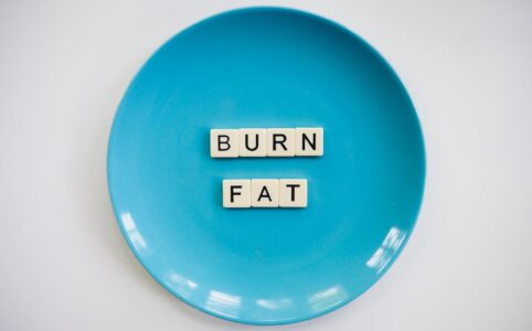 photo of a burn fat text on round blue plate