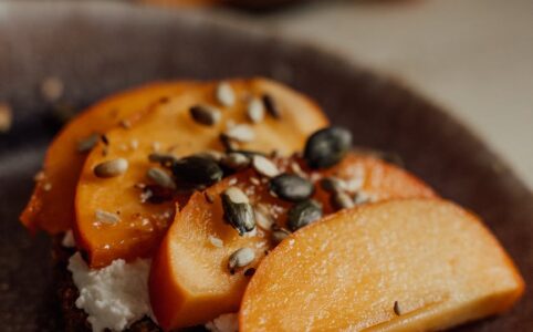 brown and black pastry on black round plate