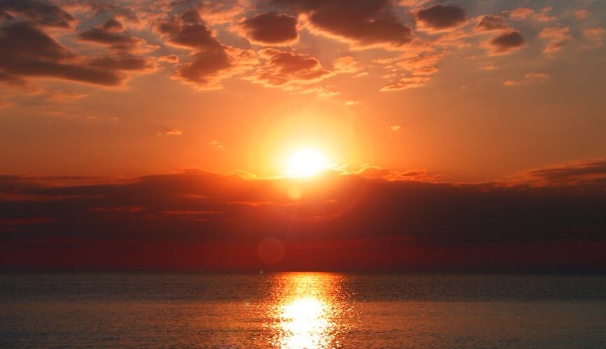 calm blue sea during golden hour