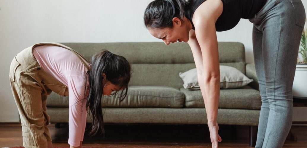 woman exercising with her daughter