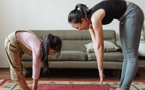 woman exercising with her daughter