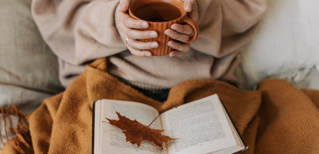 person holding a cup of tea