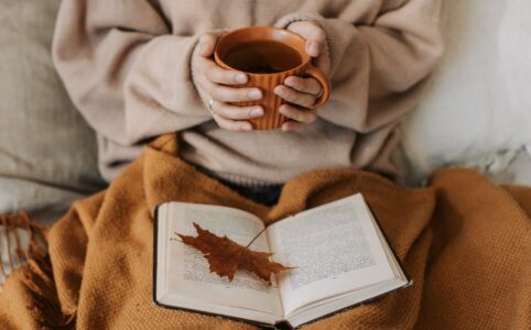 person holding a cup of tea