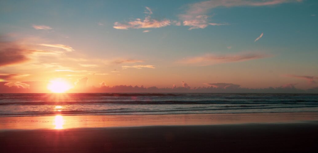 photo of shore and sunset