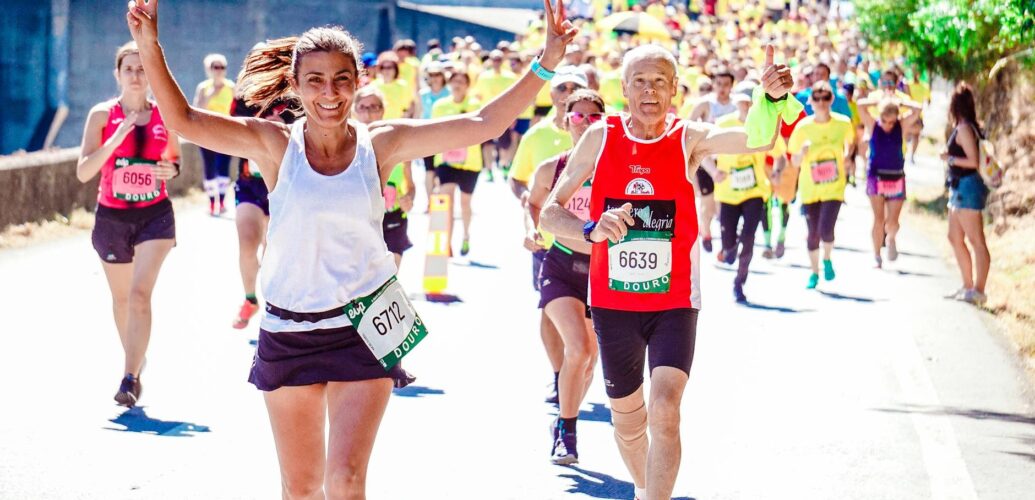 female and male runners on a marathon