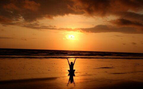 silhouette of person raising its hand